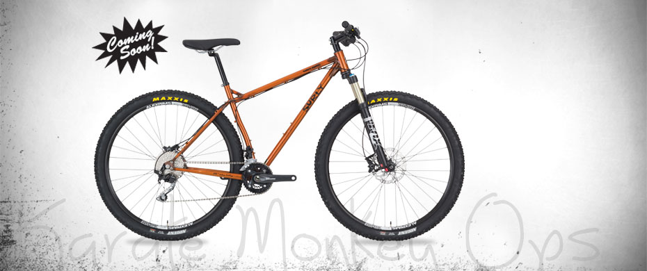 Surly Karate Monkey Ops bike - orange - right side view - faded white background with a Coming Soon burst