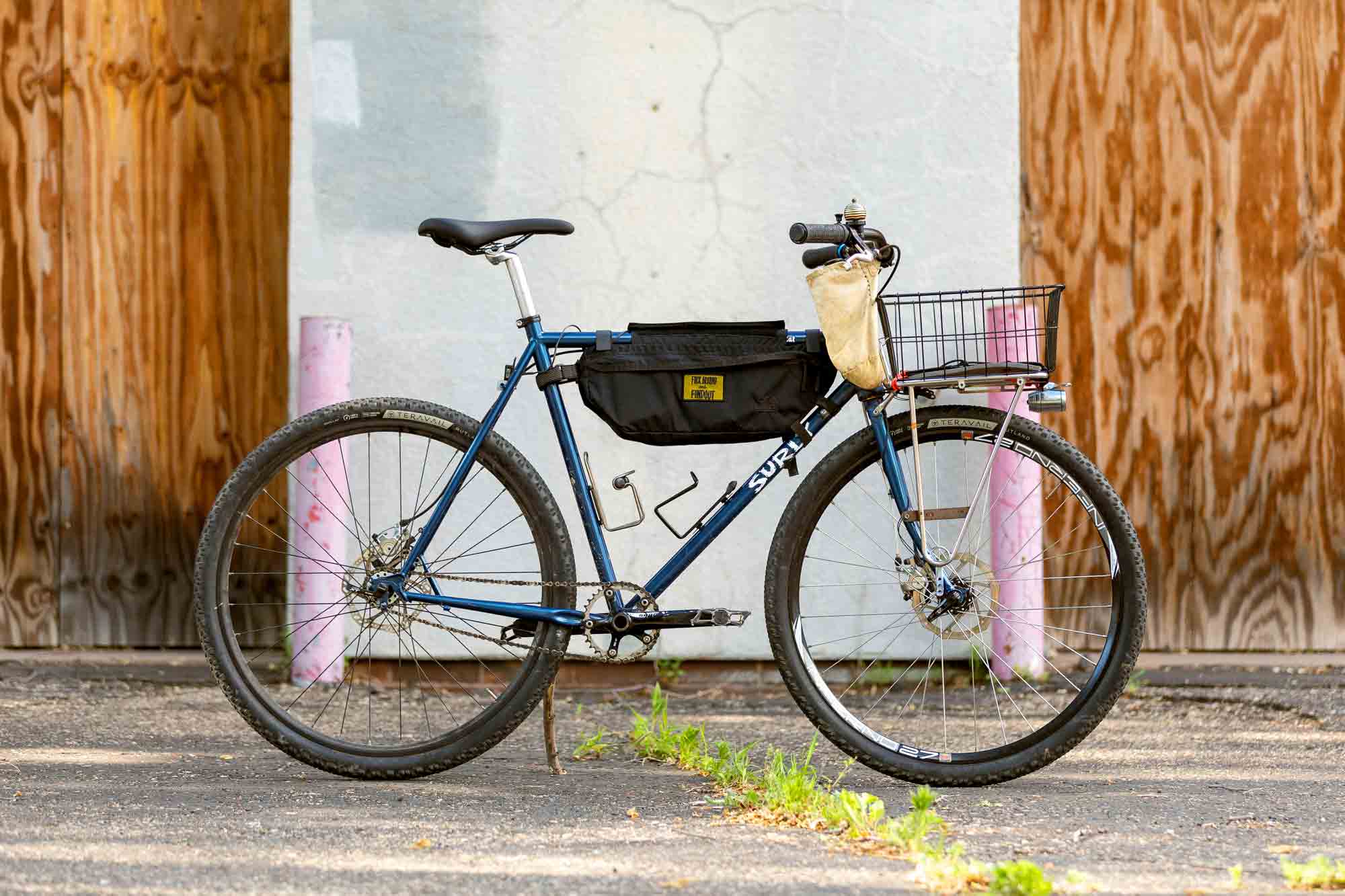 Make It Your Own - Surly Straggle Rat custom bike build using blue Surly Straggle frameset, single speed with front rack/ basket