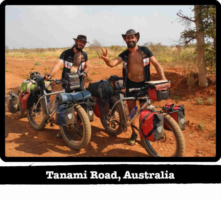 Two cyclists standing next to their Surly fat bikes in the outback - Tanami Road, Australia 