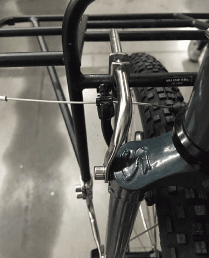 Downward left side view of a Surly Pack rack, mounted to the fork on a bike
