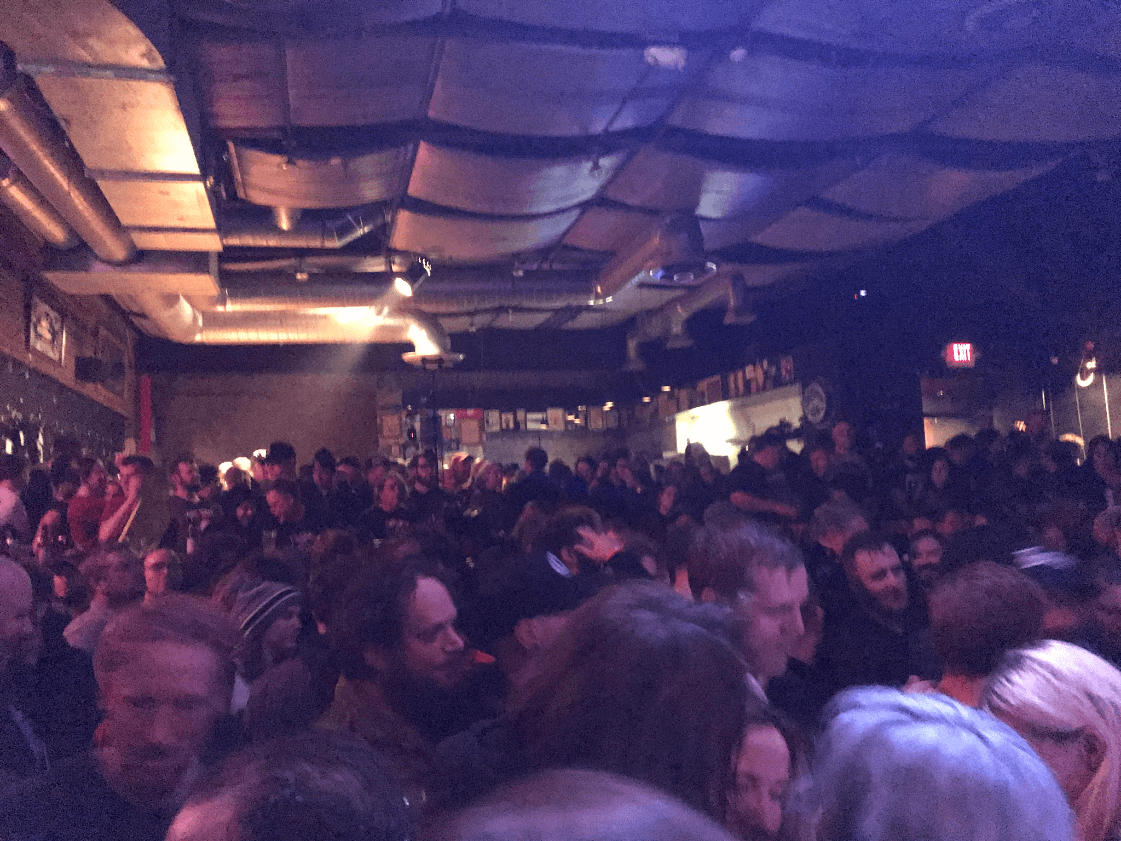 A dim room at the Triple Rock Social Club crowded with people