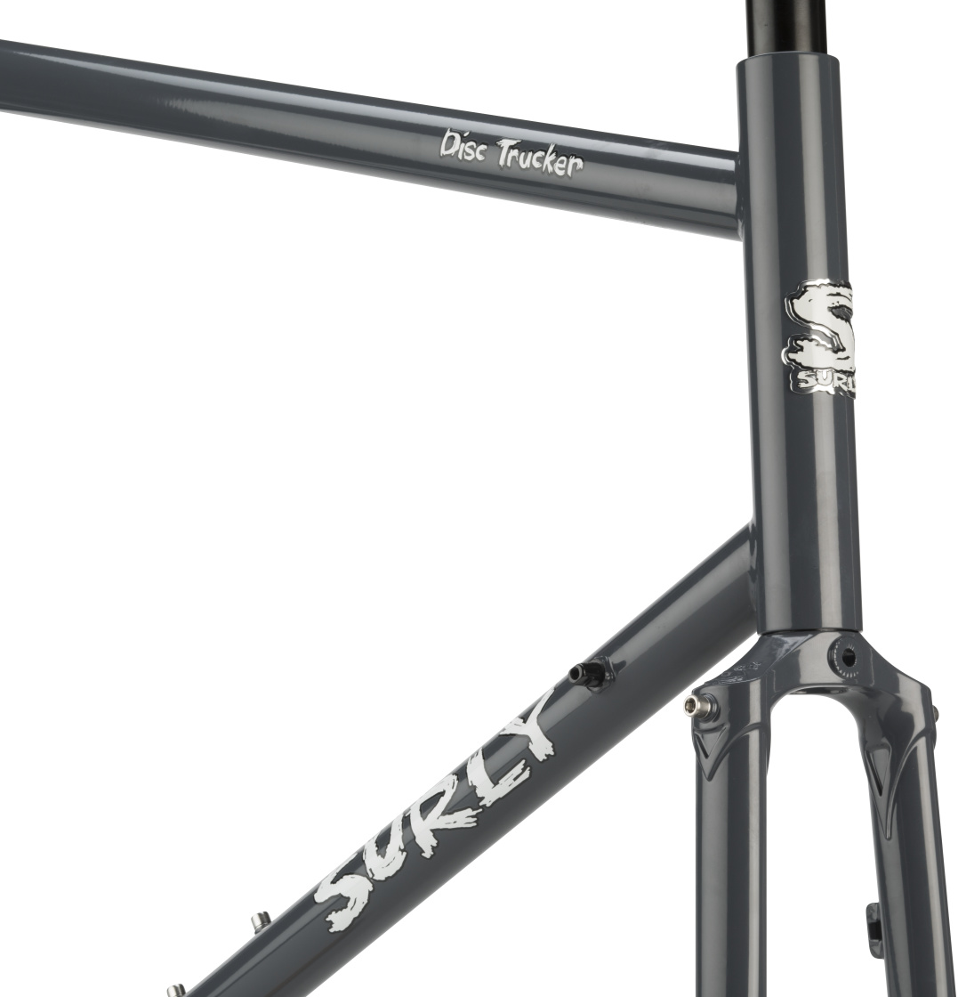 Partial front view of a Surly Disc Trucker bike frame and fork - Bituminous Gray color