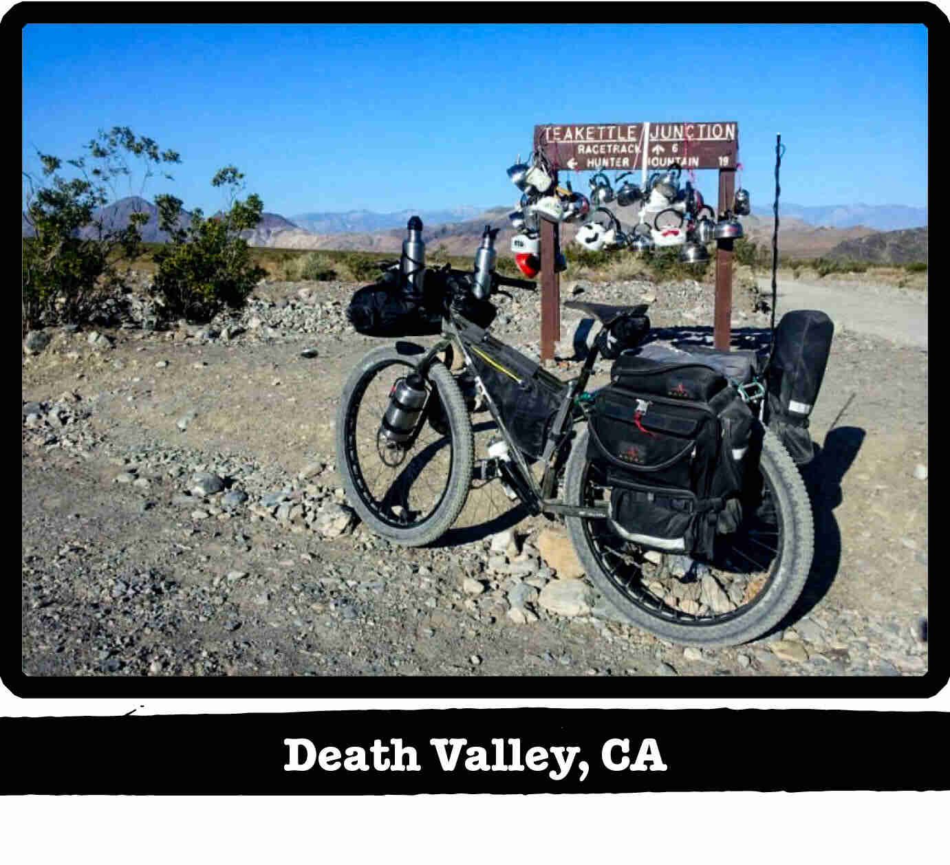 Left side view of a Surly ECR fat bike on a rocky trail, with hills in the background - Death Valley, CA tag below image