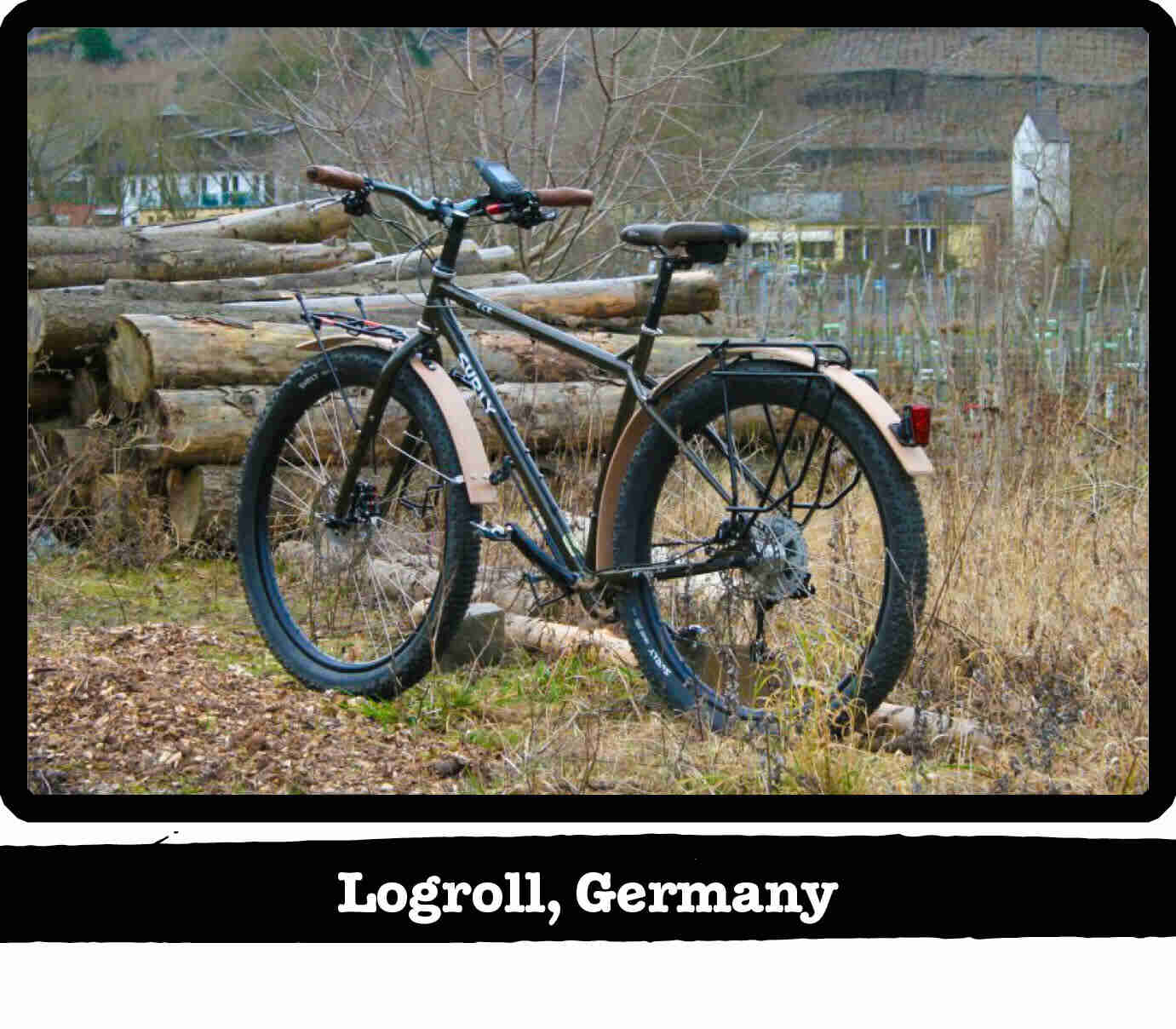 Left side view of a Surly ECR bike, with a pile of longs in background - Logroll, Germany tag below image