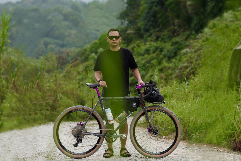 Hafis Hassan Standing with his Straggler Bike