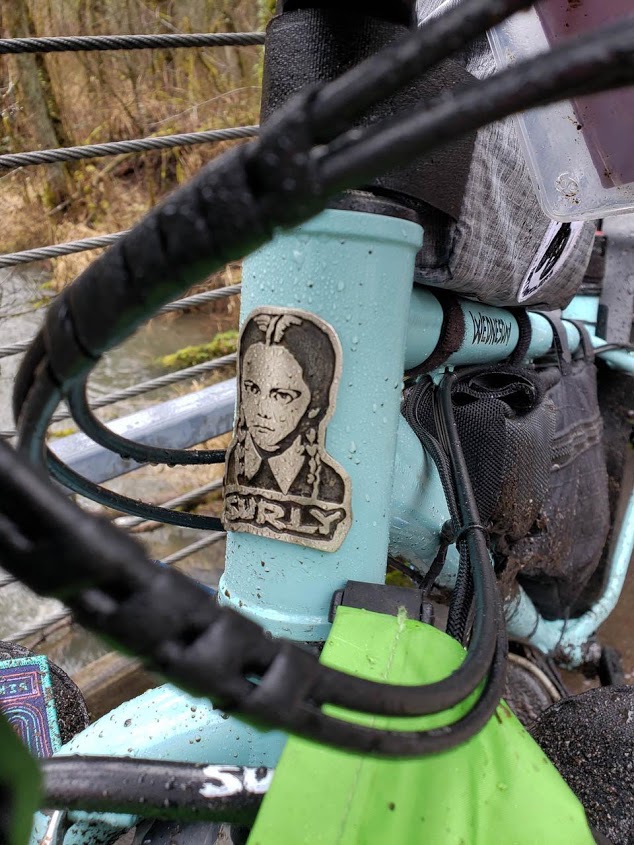 Front close up view of the head tube of a Surly Ice Truck fat bike with a Surly emblem showing Wednesday Adams