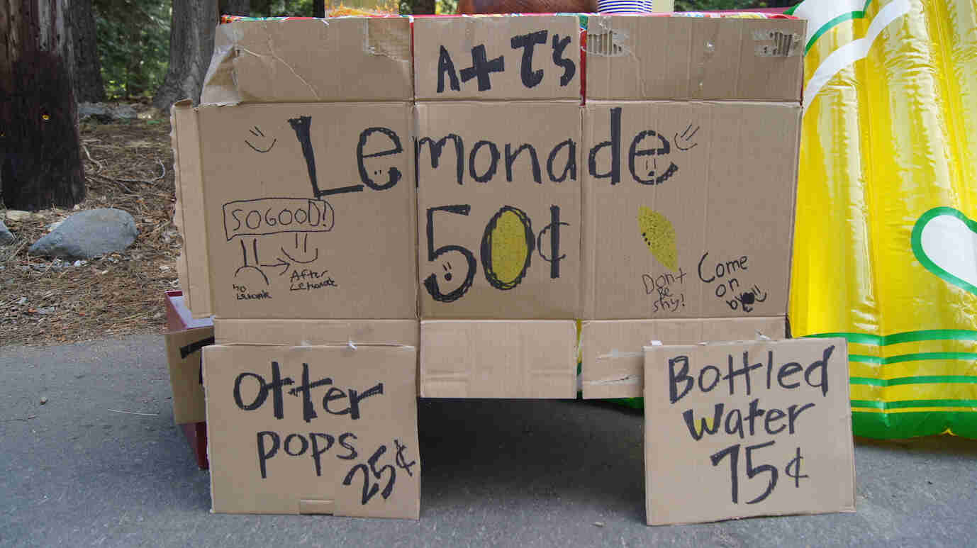 A cardboard sign for a lemonade stand