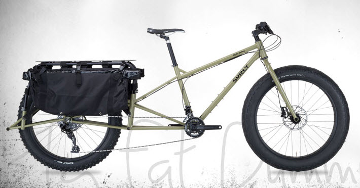 Right side view of a tan Surly Big Fat Dummy bike, with a white background behind