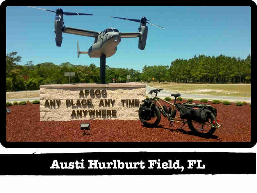 A Surly Big Fat Dummy bike in front of a AFSOC stone sign - Austi Hurlburt Field, FL tag below image
