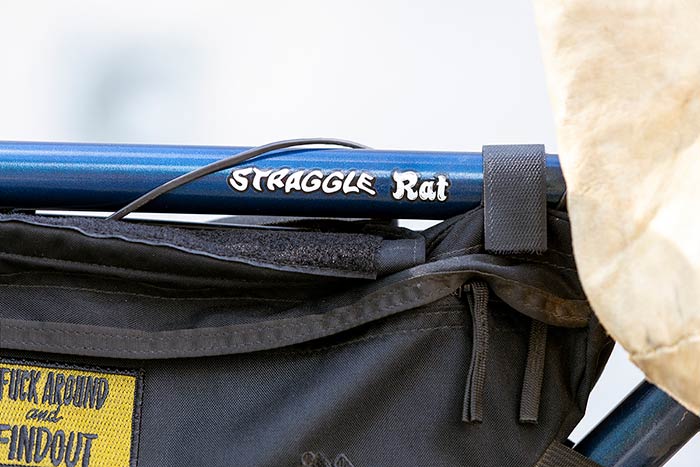 Close-up of frame bag with yellow patch applied and mix of Surly bike decals, ‘Straggle®’ and ‘Rat’. The Rat decal from the Pack Rat bike 