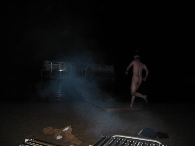 Rear view of a person streaking at night